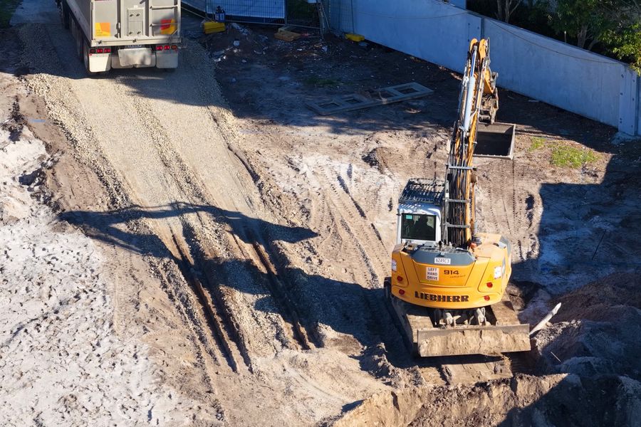 Excavator and tipper on a residential site